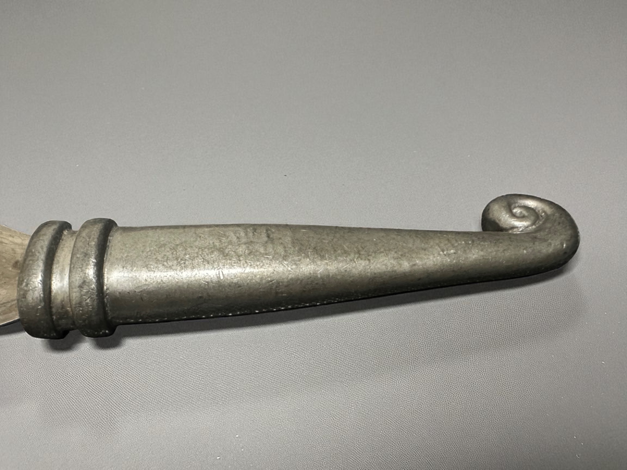 Pewter handle with spiral detail – close-up